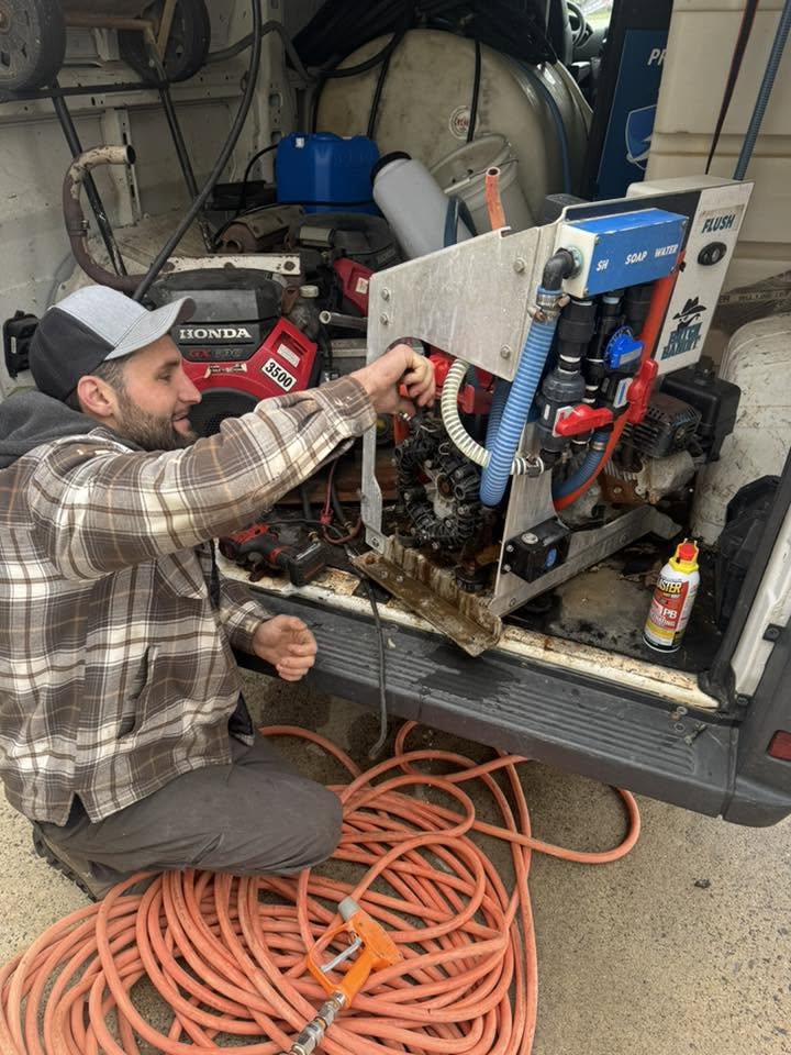 AmChem technician servicing a pressure washing manifold