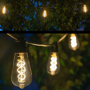 FlexFilament TM LED Patio String Light Set with 10 5W ST64 Edison Bulbs on Black Wire