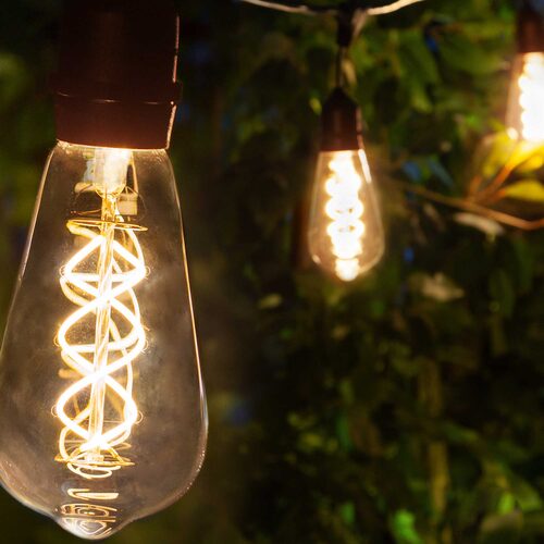 FlexFilament TM LED Patio String Light Set with 10 5W ST64 Edison Bulbs on Black Wire, with Drops