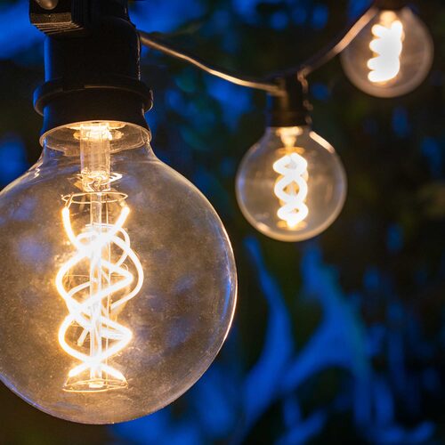 FlexFilament TM LED Patio String Light Set with G95 Edison Bulbs on Black Wire