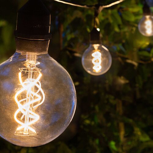 FlexFilament TM LED Patio String Light Set with G95 Edison Bulbs on Black Wire, with Drops