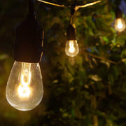 Warm White FlexFilament TM Shatterproof LED Patio String Light Set with S14 Bulbs on Black Wire, with Drops