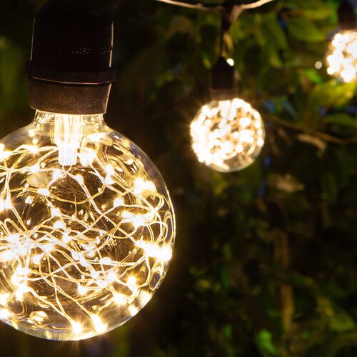 Warm White LEDimagine TM Patio String Light Set with G95 Fairy Light Bulbs on Black Wire, with Drops
