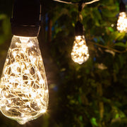 Warm White LEDimagine TM Patio String Light Set with 10 ST64 Fairy Light Bulbs on Black Wire, with Drops