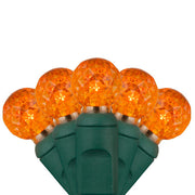 70 G12 Amber LED String Lights, Green Wire, 4" Spacing