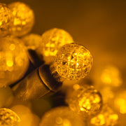 70 G12 Gold LED String Lights, Green Wire, 4" Spacing